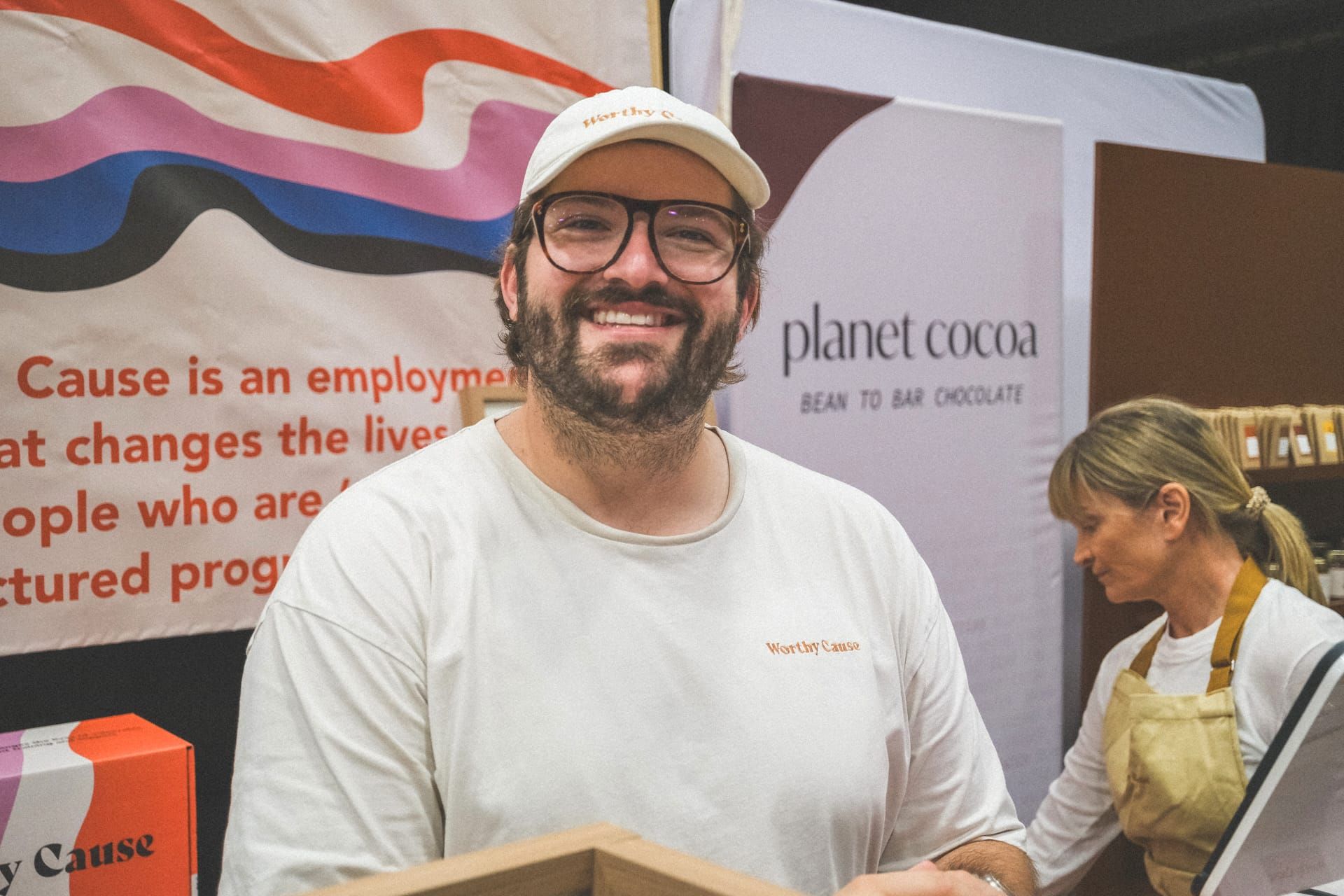 Rick Cohen at a Worthy Cause market stall with freshly baked cookies