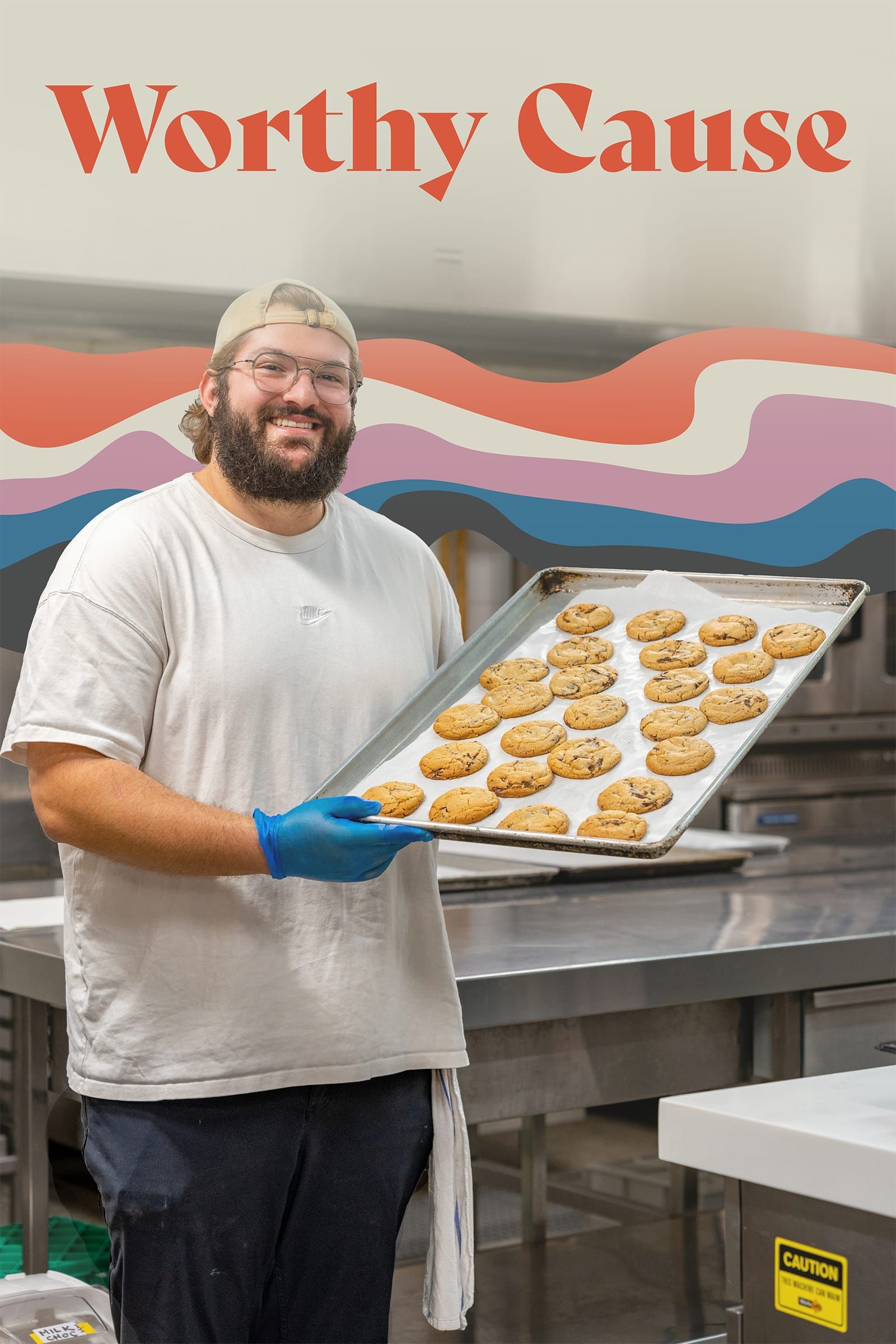 Rick Cohen in the kitchen with a tray of cookies