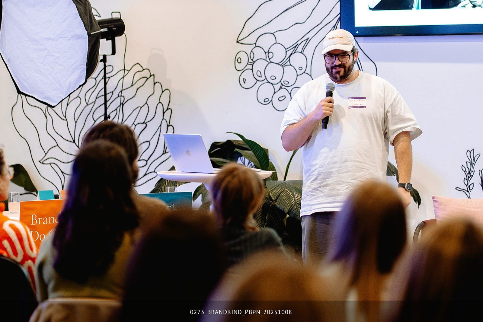 Rick Cohen speaking to an engaged audience at a community talk